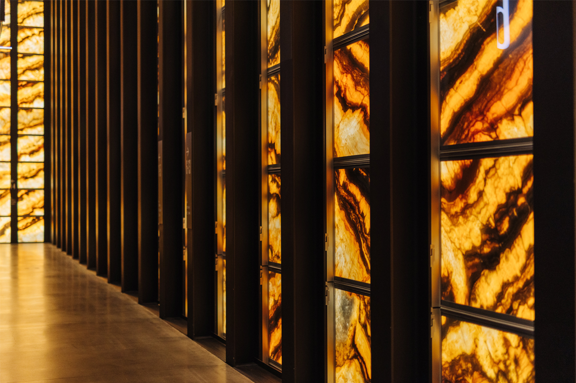 The PAC NYC building exterior gets its unique look from panes of glass and thinly sliced marble.